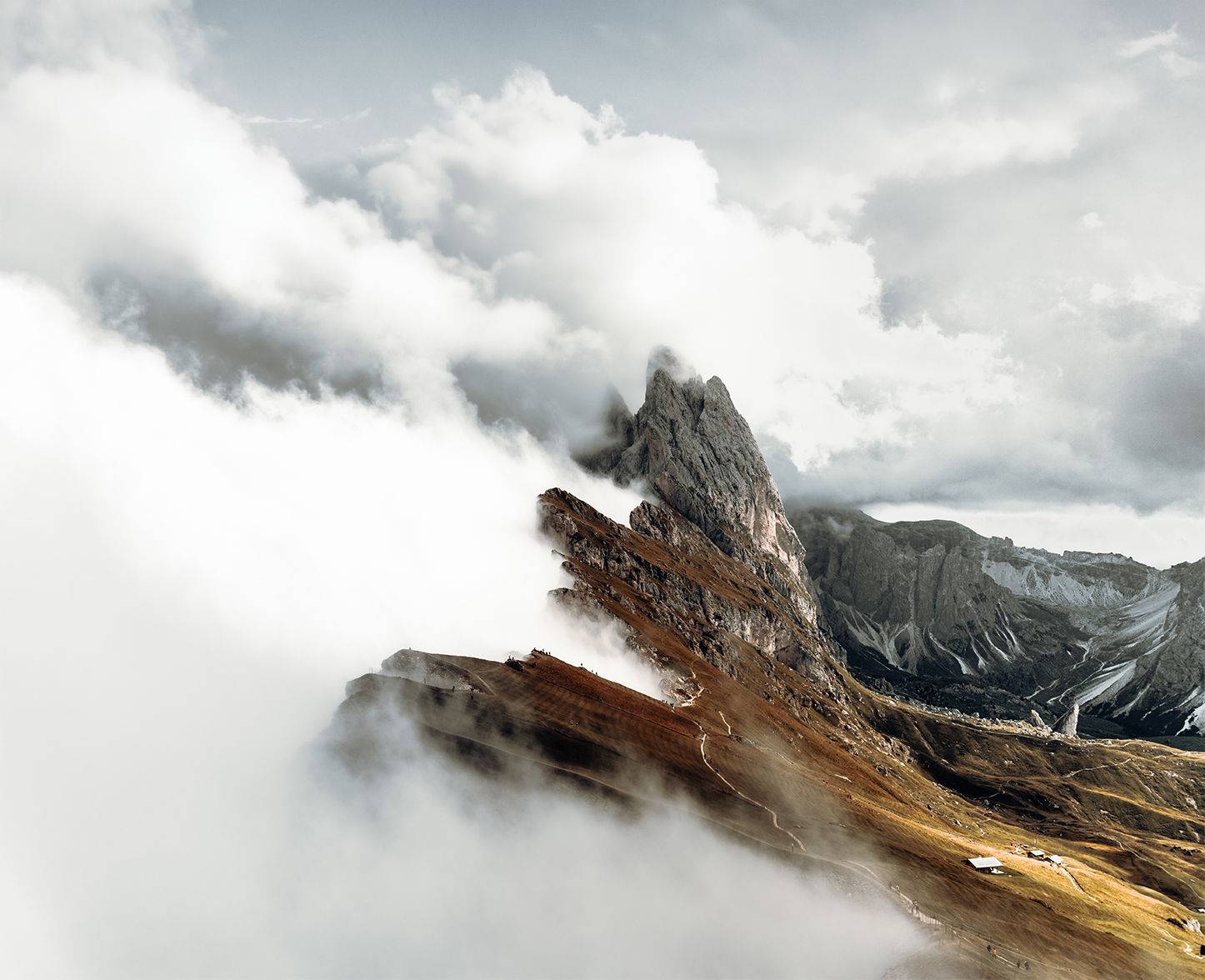Mountain peaks emerging through clouds